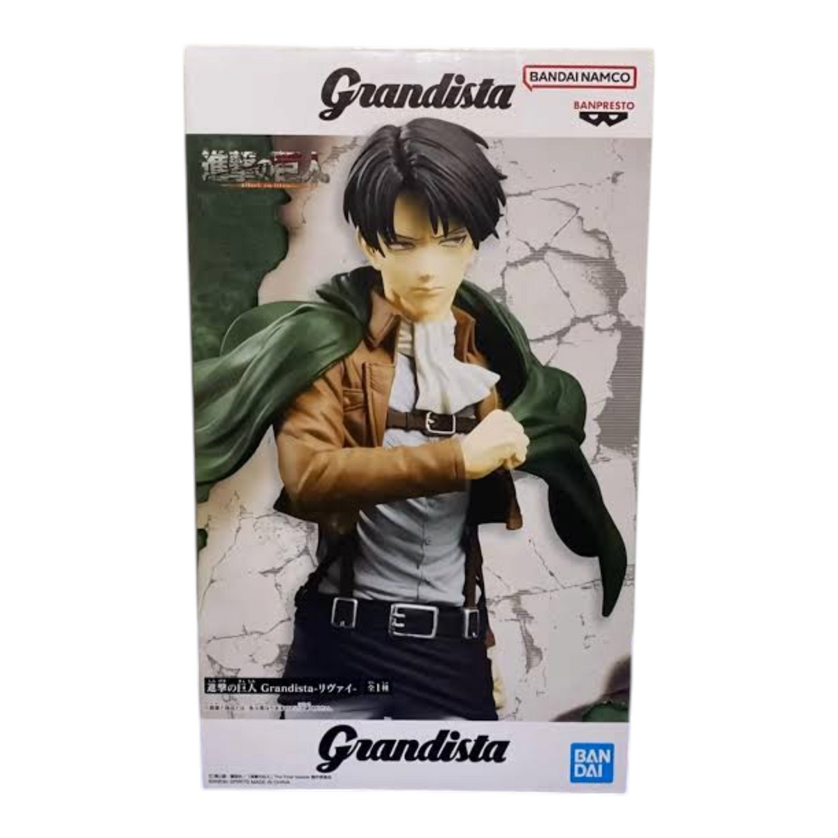 Boîte de la figurine Levi Ackerman Grandista – Attack on Titan avec illustration du personnage en uniforme.
