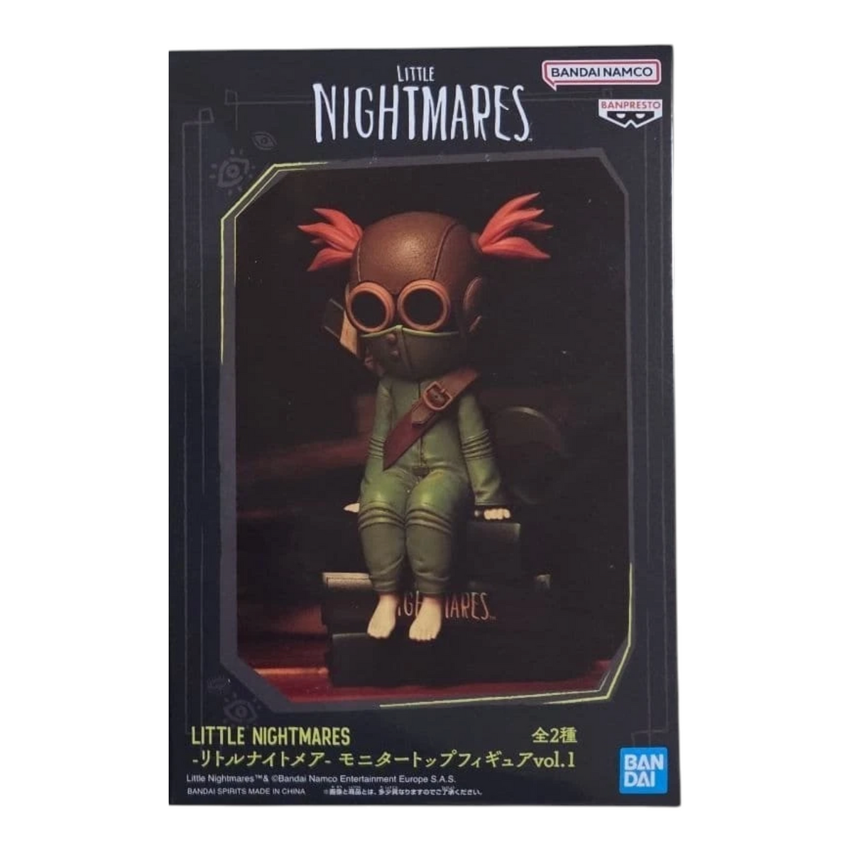 Boîte de la figurine Alone Monitor Top Figure Vol. 1 – Little Nightmares III, avec visuel du personnage sur des livres.
