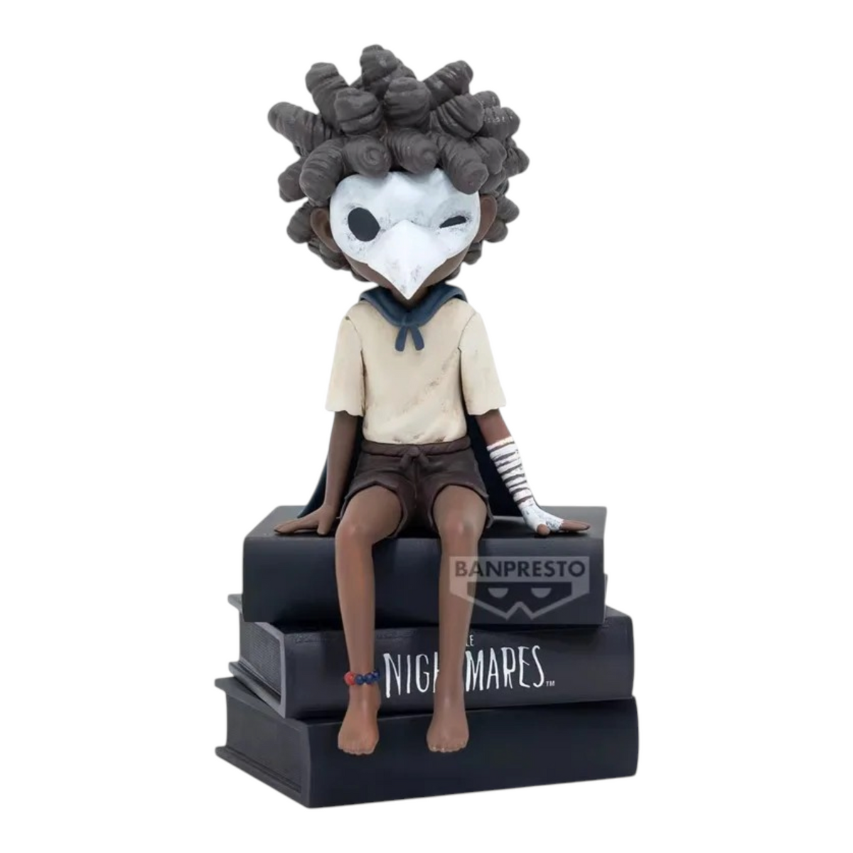 Figurine Low Monitor Top Figure Vol. 2 – Little Nightmares III, assis sur une pile de livres noirs.